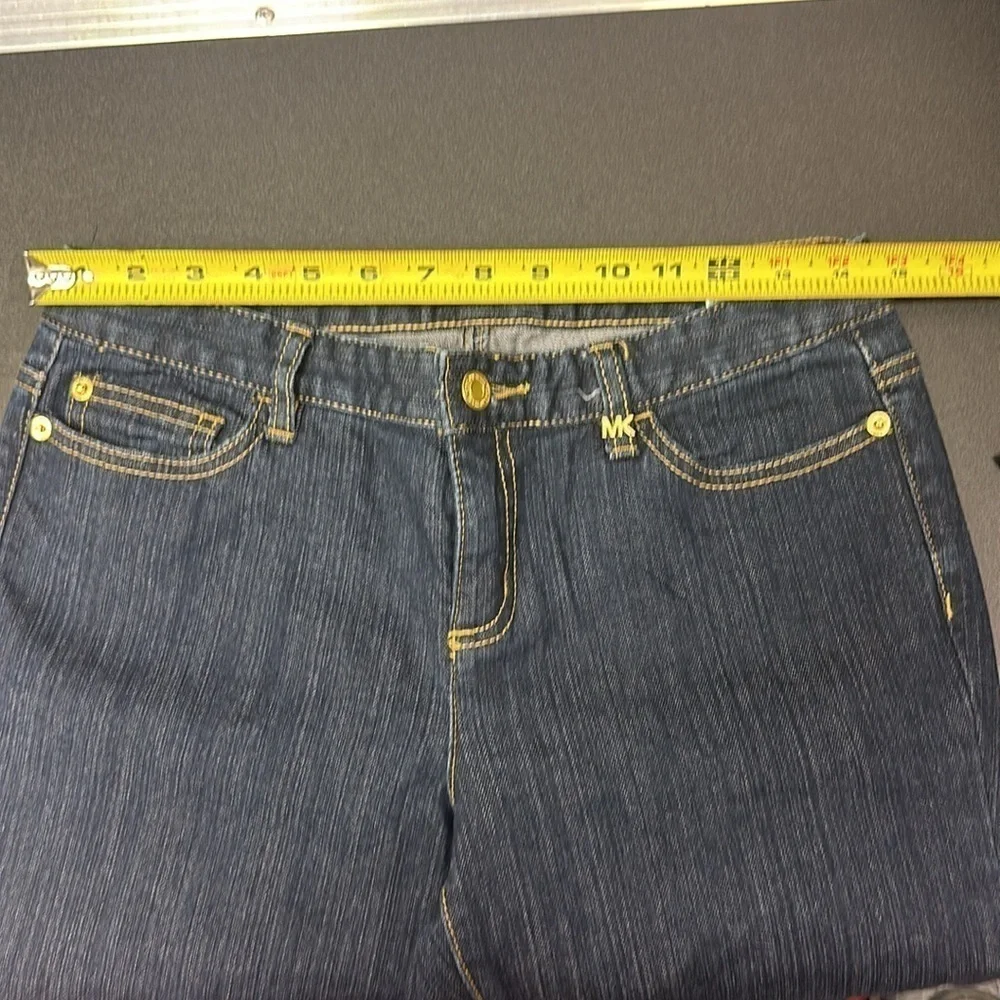 94.  Michael Kors dark blue skinny jeans with embellished pockets size 4